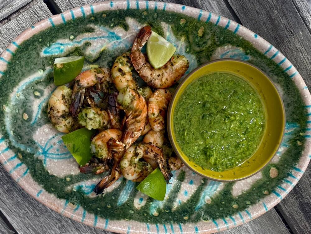 Grilled shrimp with a lime-green sauce. (Kathy Gunst/Here & Now)