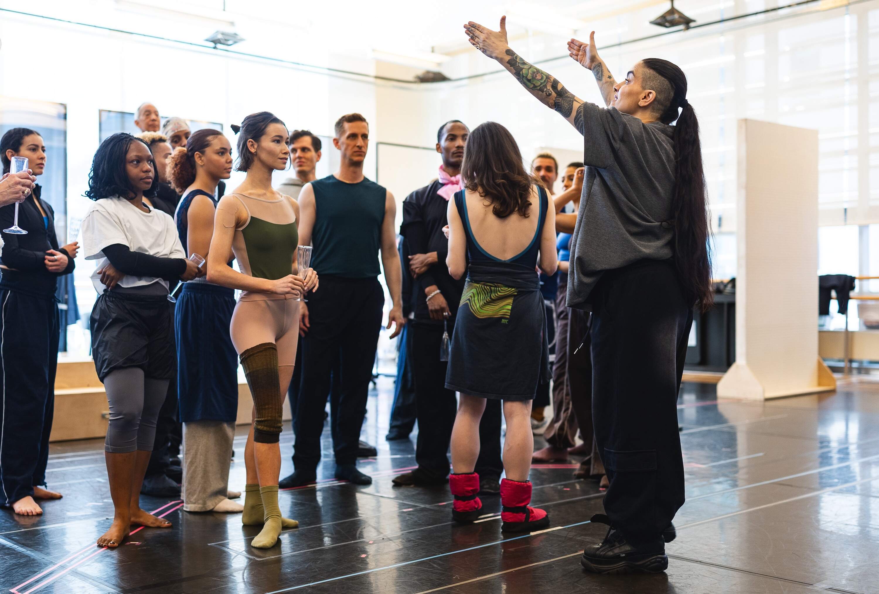 Director and choreographer Sonya Tayeh addresses the ensemble in rehearsal. (Courtesy A.R.T./Maggie Hall)