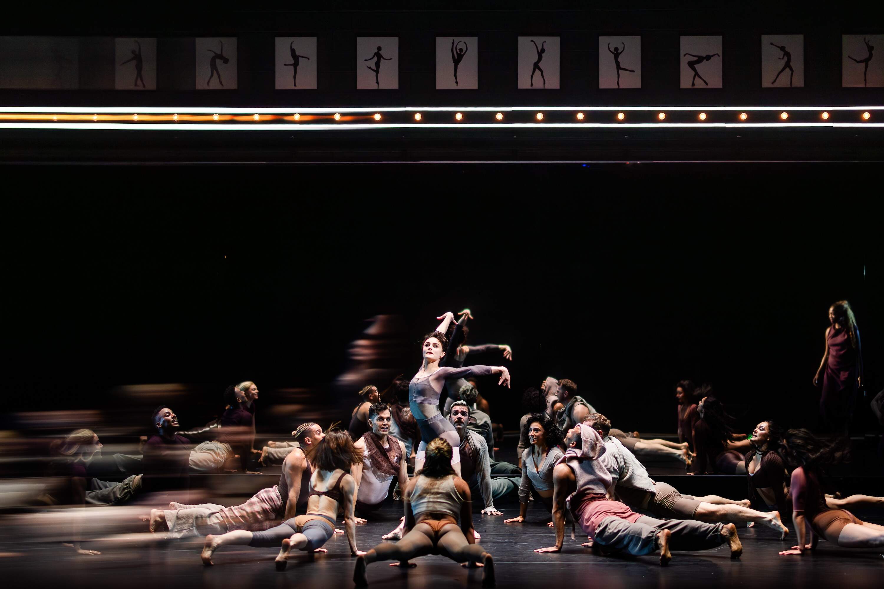 Members of the ensemble circle Melanie Moore. (Courtesy A.R.T./Hawver and Hall)
