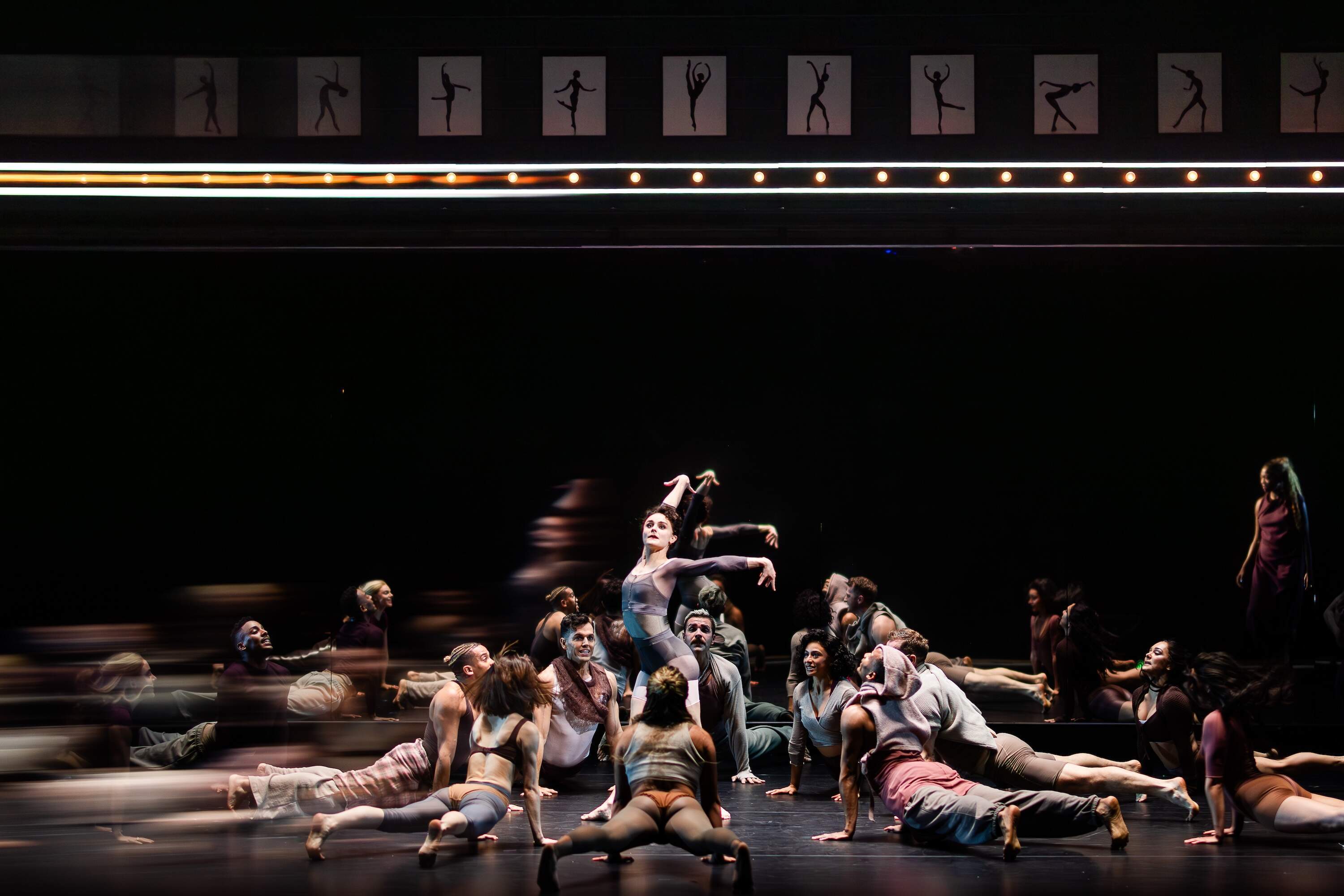 Members of the ensemble circle Melanie Moore. (Courtesy A.R.T./Hawver and Hall)