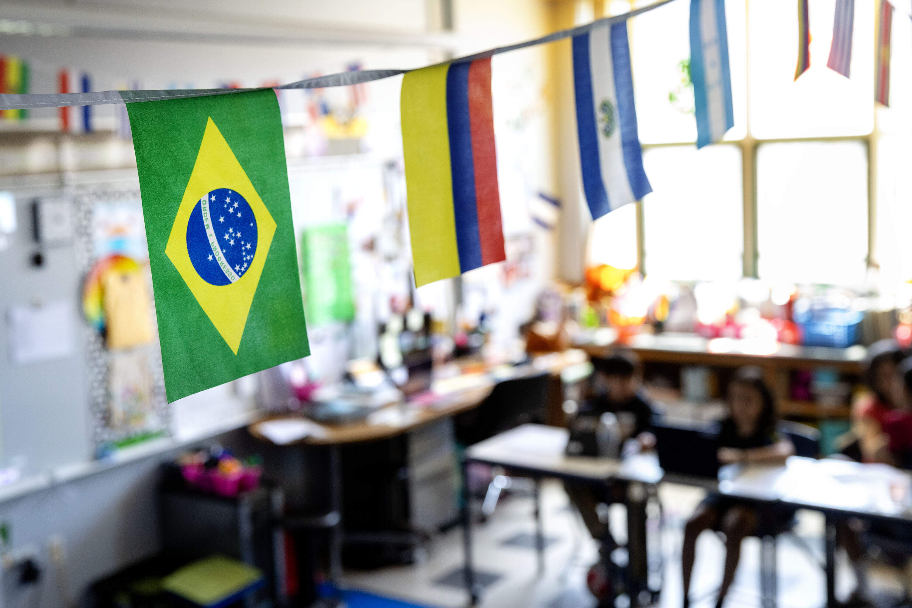 Country flags hang from the ceiling of Anita Caceda's elementary school classroom in Chelsea as teachers use the World Cup as a teaching opportunity. (Robin Lubbock/WBUR)