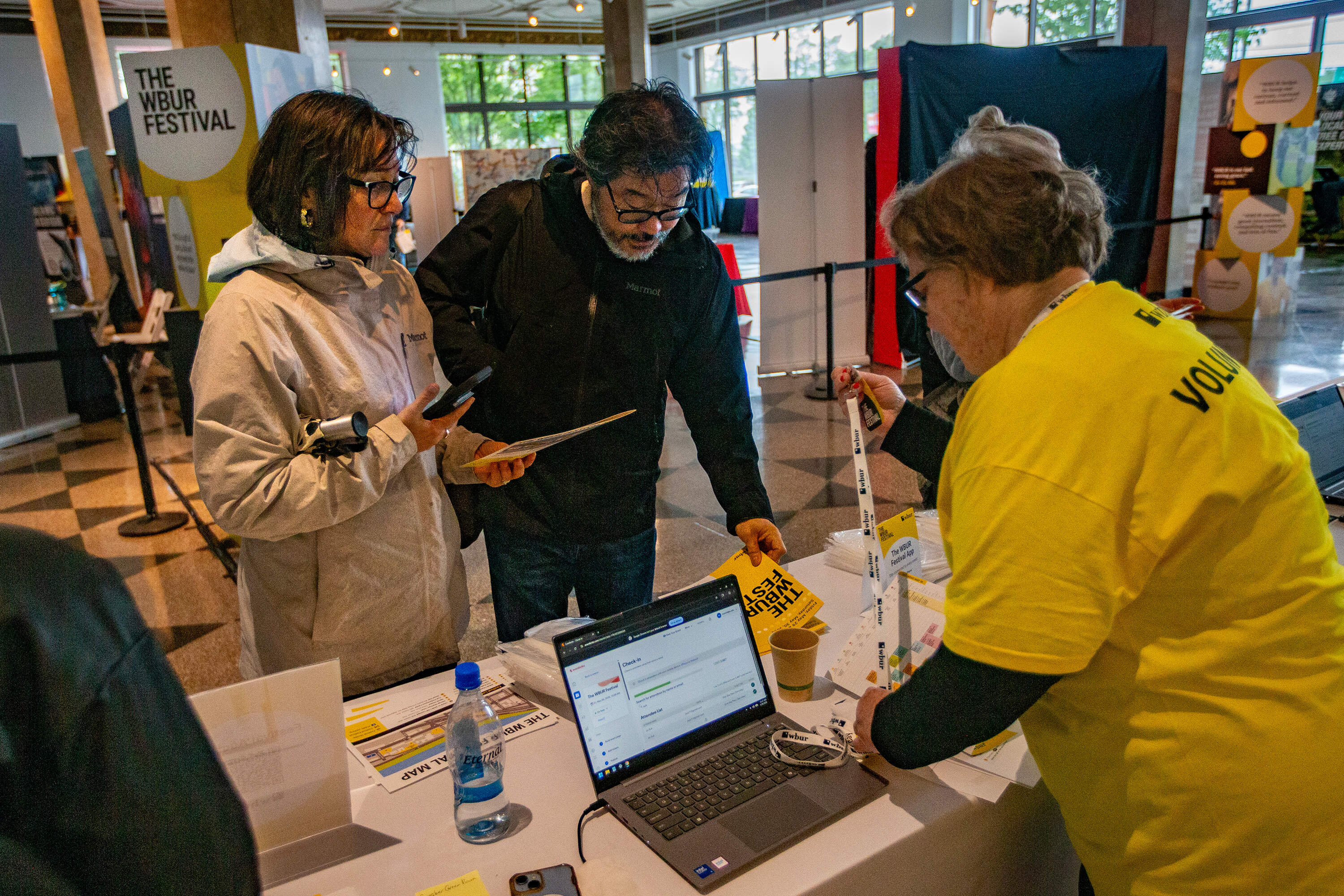 Festival attendees check in at The WBUR Festival Hub in Boston on May 30. (Jesse Costa/WBUR)