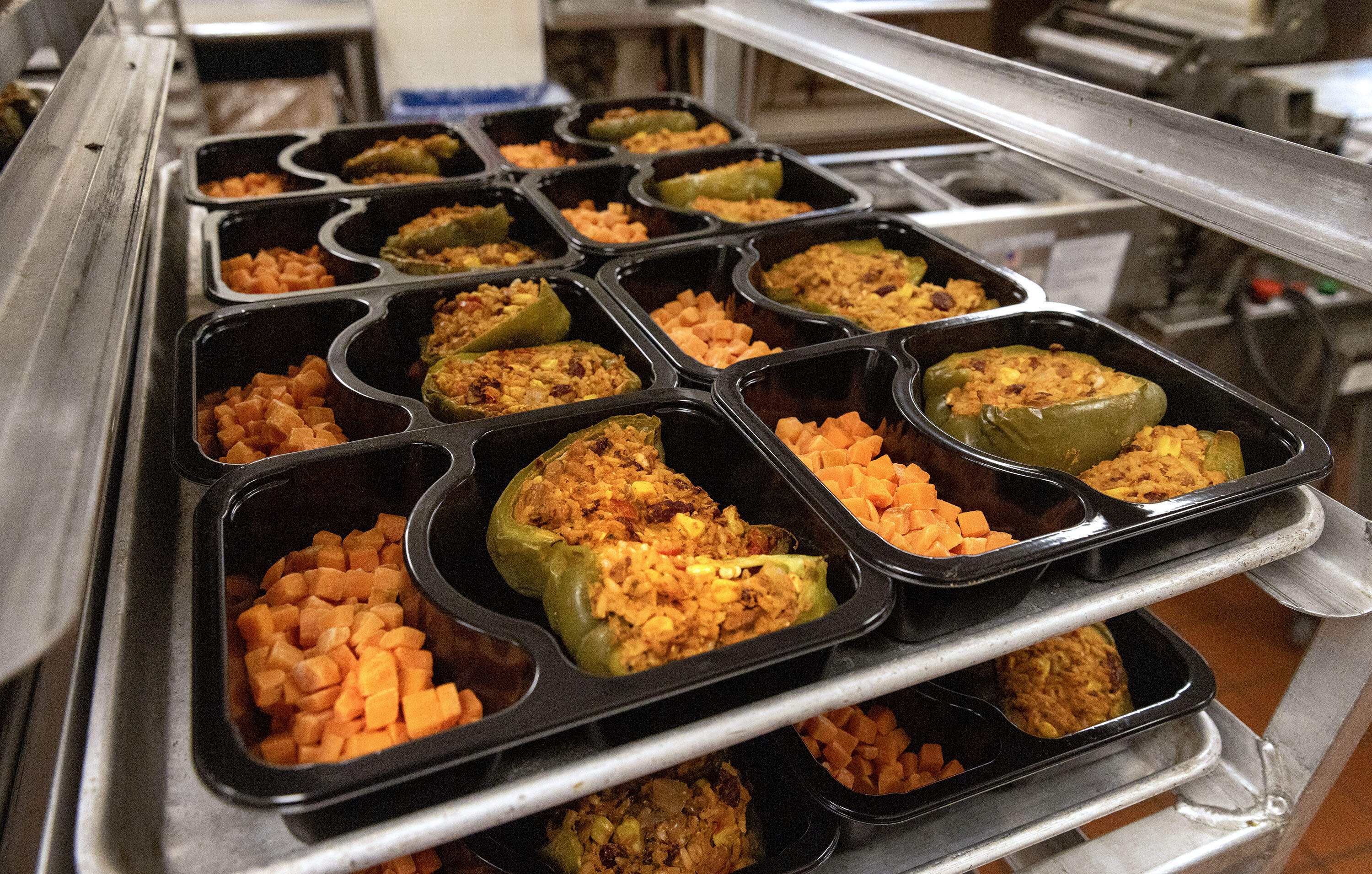 Trays of stuffed peppers and carrots at Community Servings in Jamaica Plain, Mass. The food is for people with chronic diseases who are unable to cook their own meals. (Robin Lubbock/WBUR)