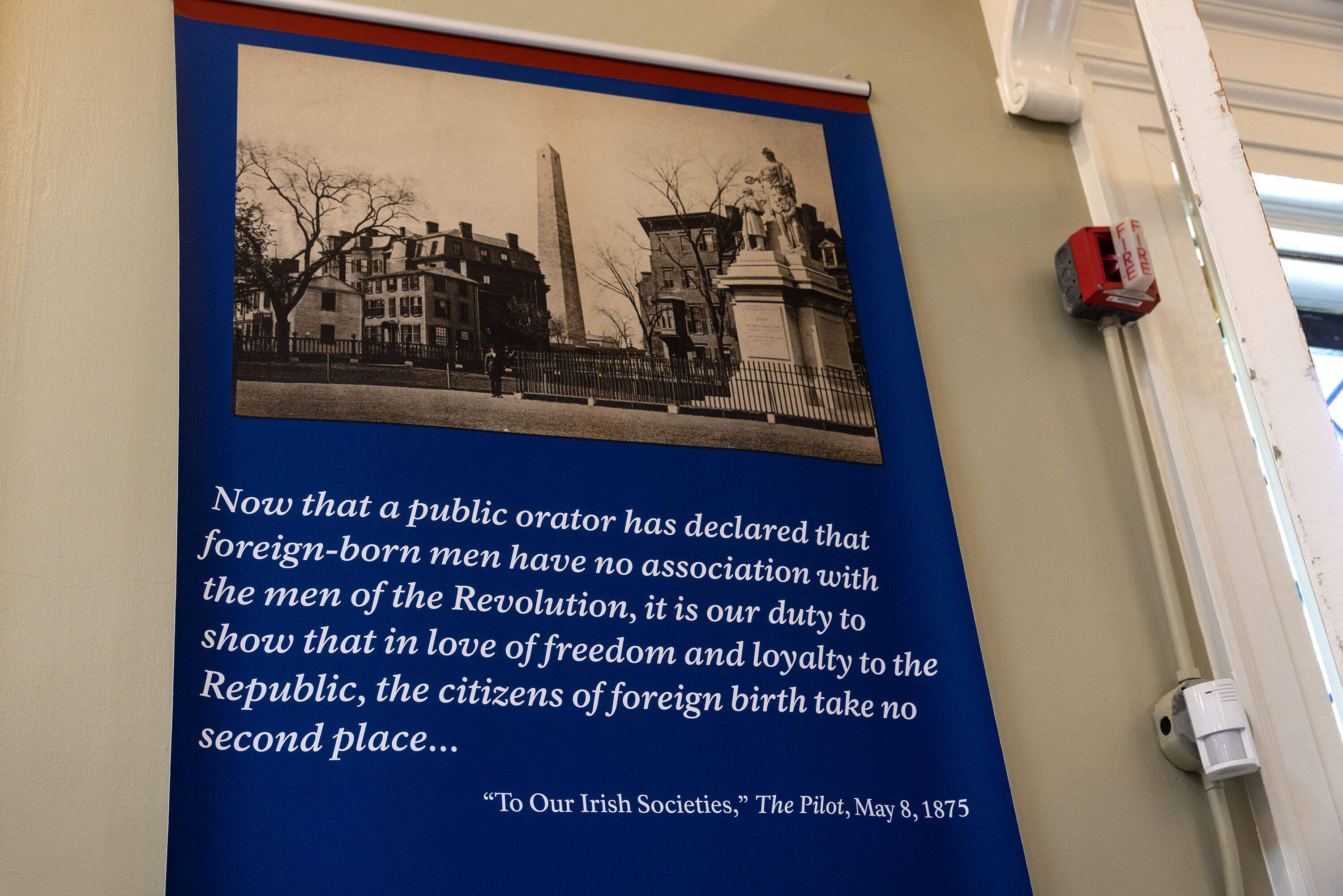 A quote from "The Pilot" from 1875, on the wall of the Lodge at the Bunker Hill Monument in Charlestown, Mass. on June 5, 2026. (Robin Lubbock/WBUR)