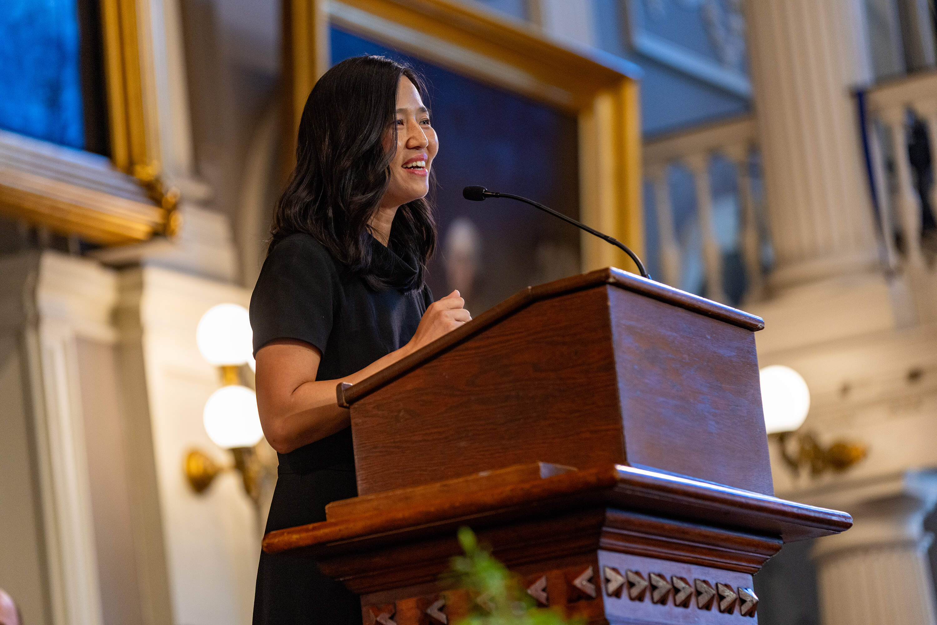 Mayor Michelle Wu speaks first during the Barney Frank "celebration of life" ceremony at Faneuil Hall. (Jesse Costa/WBUR)
