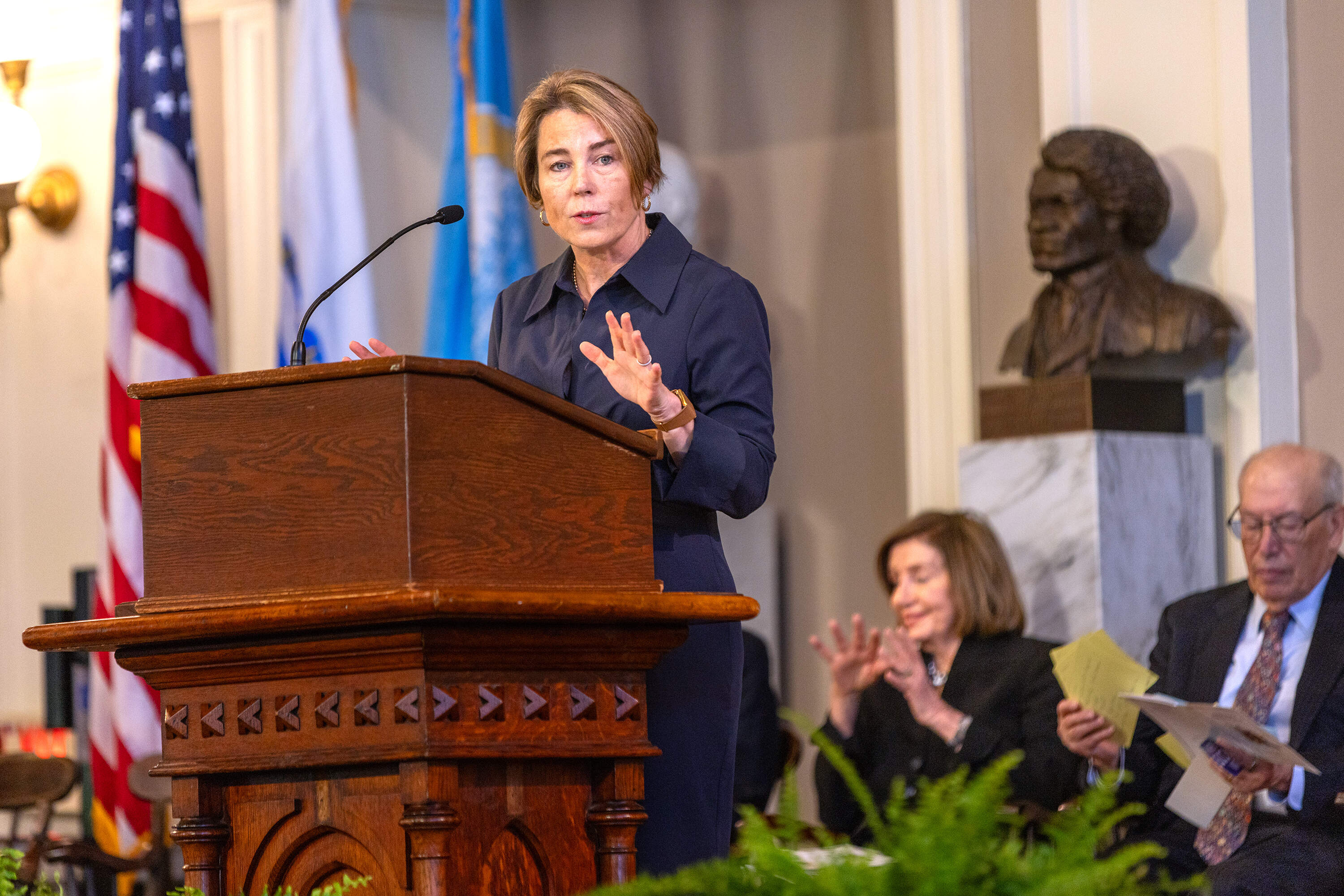 Gov. Maura Healey speaks during the ceremony in memory of Barney Frank at Faneuil Hall. (Jesse Costa/WBUR)