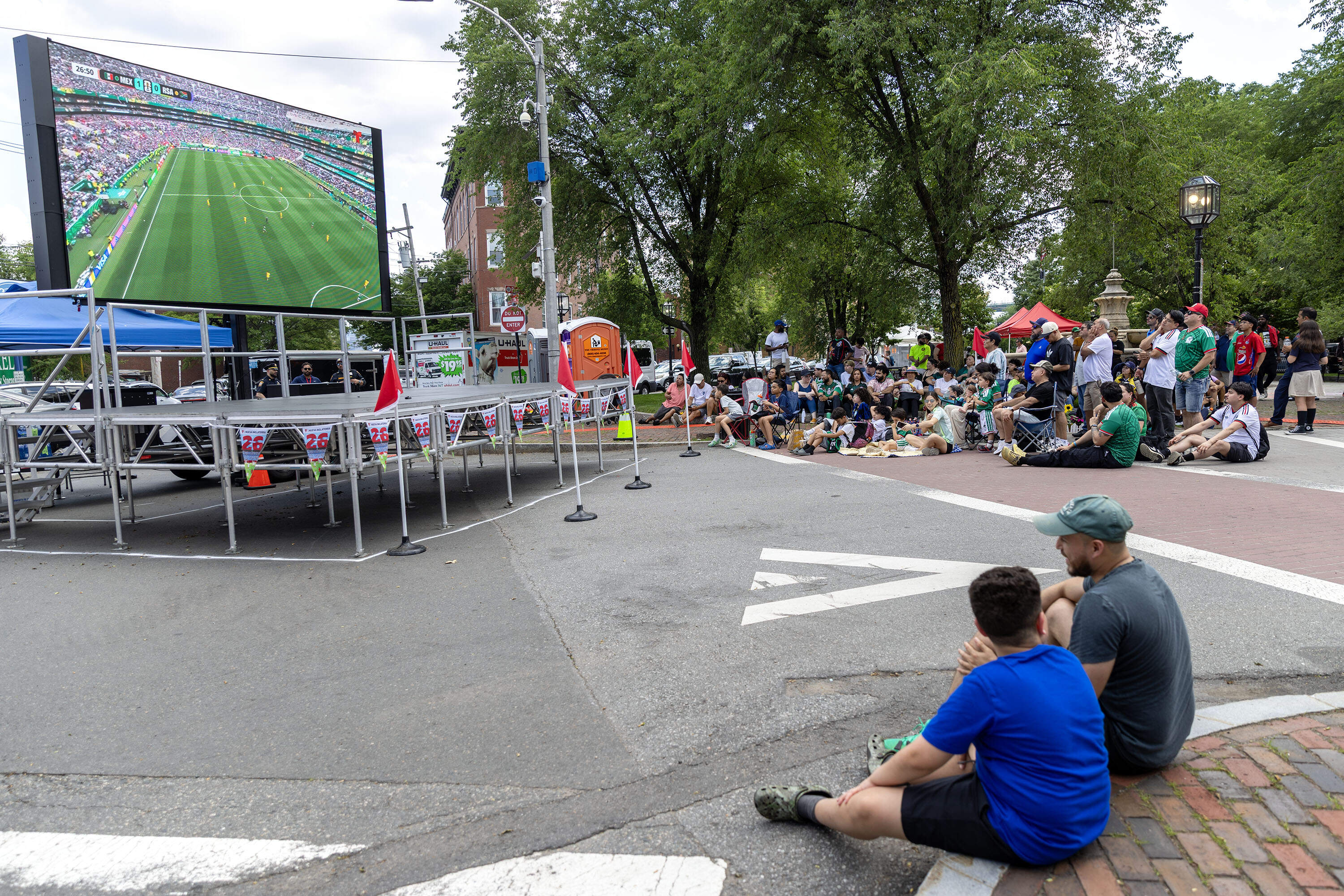 Soccer fans gathered in Chelsea Square to watch the first soccer game of the 2026 World Cup: Mexico vs. South Africa. (Robin Lubbock/WBUR)