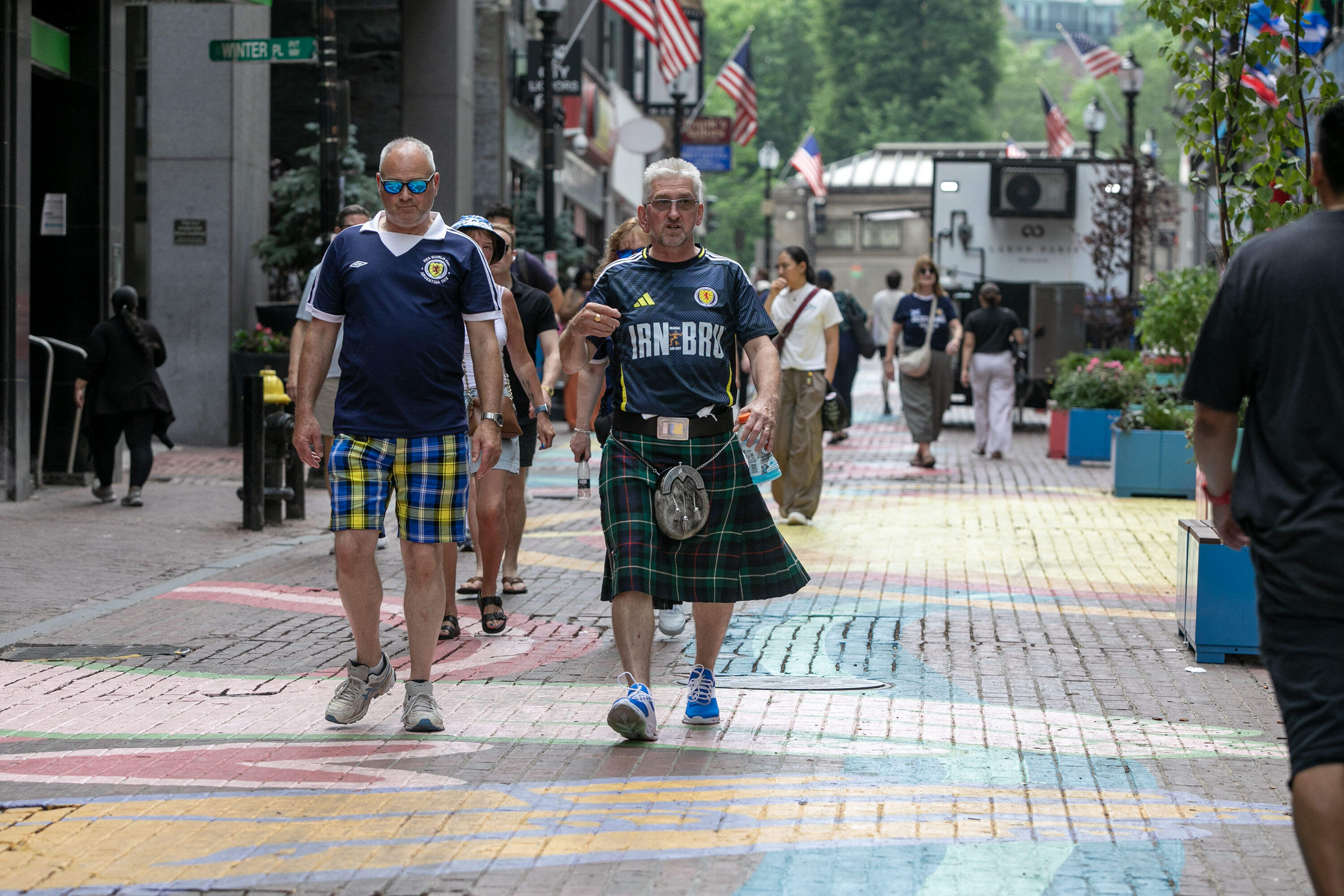 Scotland fans walk through downtown Boston, as the 2026 Men's World Cup gets underway. (Robin Lubbock/WBUR)