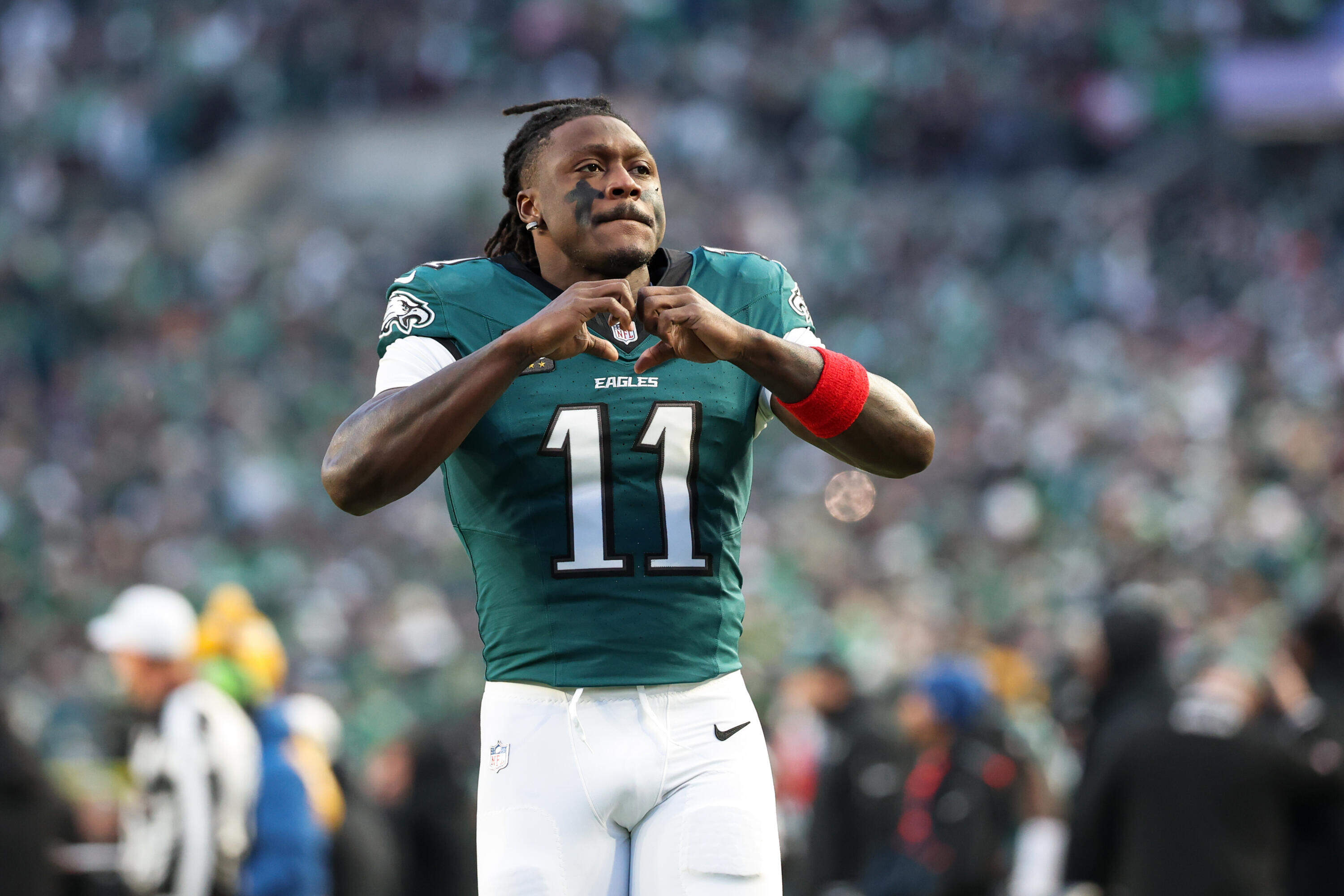 Philadelphia Eagles wide receiver A.J. Brown (11) gestures during pre-game warm-ups before an NFL wild card playoff football game, Jan. 11, 2026, in Philadelphia. (AP Photo/Terrance Williams)
