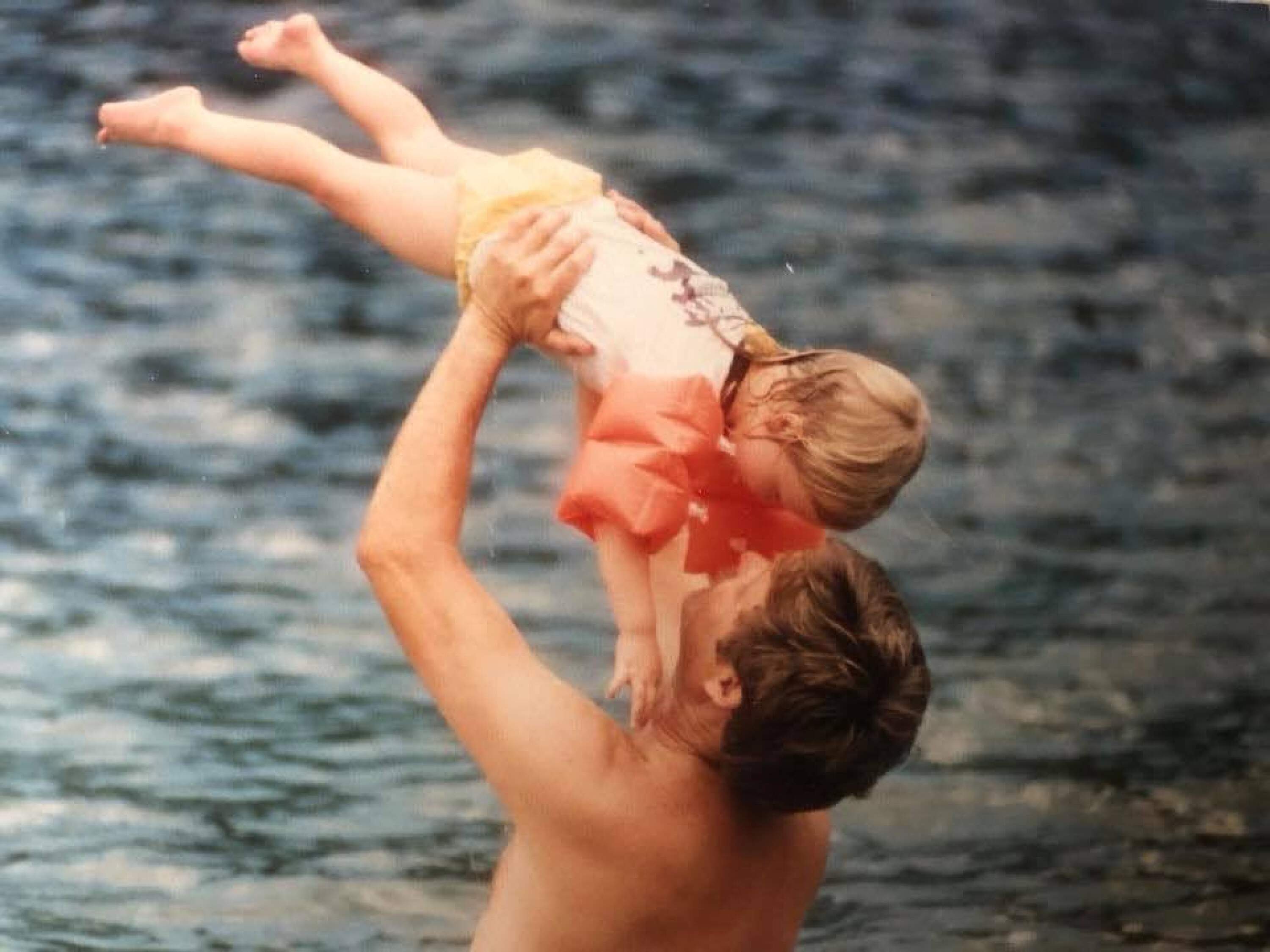 The author as a child with her father, swimming at Blue Spring State Park in Central Florida, circa 1990. (Courtesy Asha Dore)