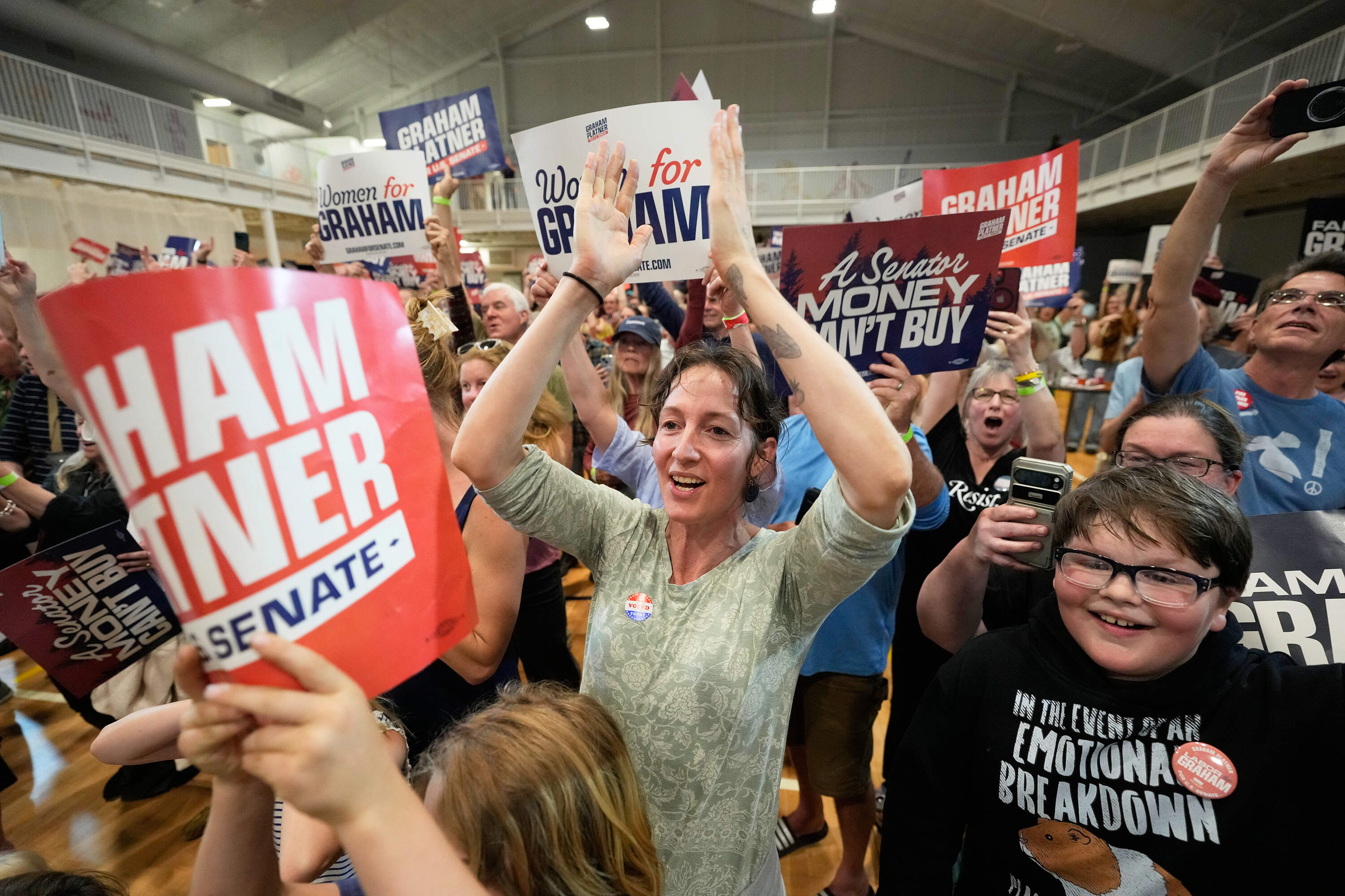 Attendees celebrate as Graham Platner speaks during a primary election night watch party after winning the Democratic nomination Tuesday, June 9, 2026. (Robert F. Bukaty/AP)