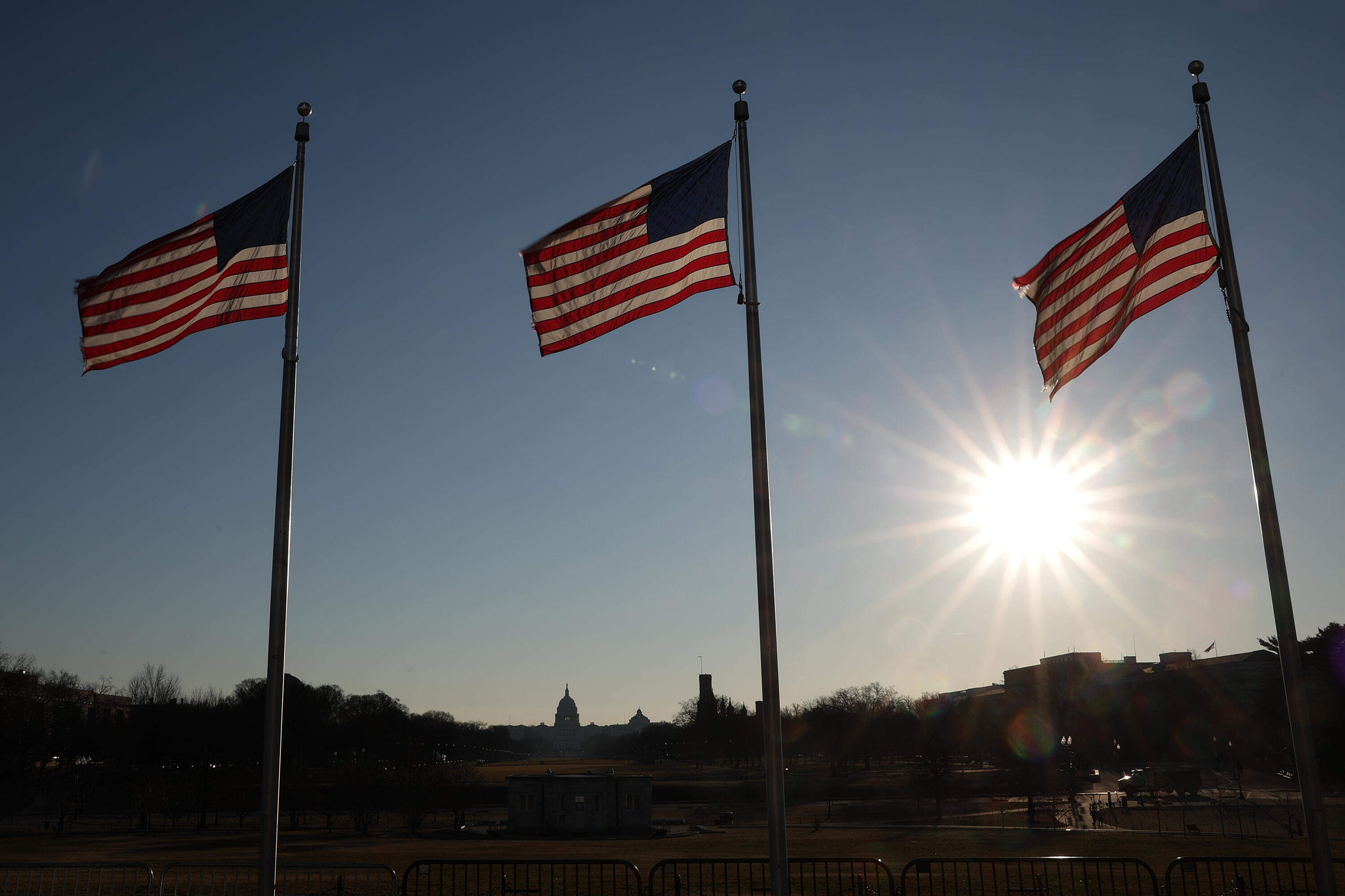 The American flag flies in front of the U.S. Capitol, (Win McNamee/Getty Images)