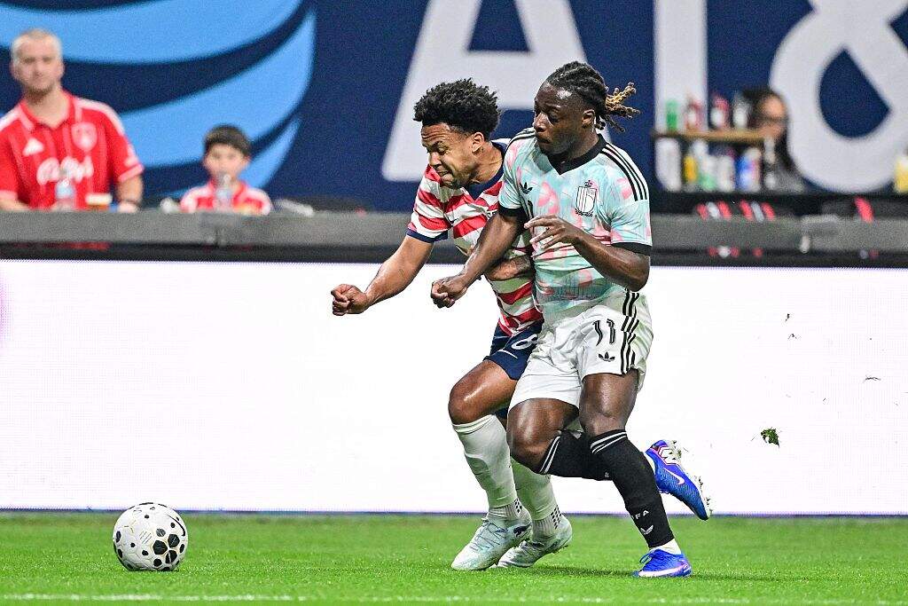 U.S.'s Weston McKennie and Belgium's Jeremy Doku fight for the ball during a friendly soccer game between the United States national team and Belgian national soccer team Red Devils in Atlanta, on Saturday 28 March 2026. (Dirk Waem/ Belga / AFP via Getty Images)