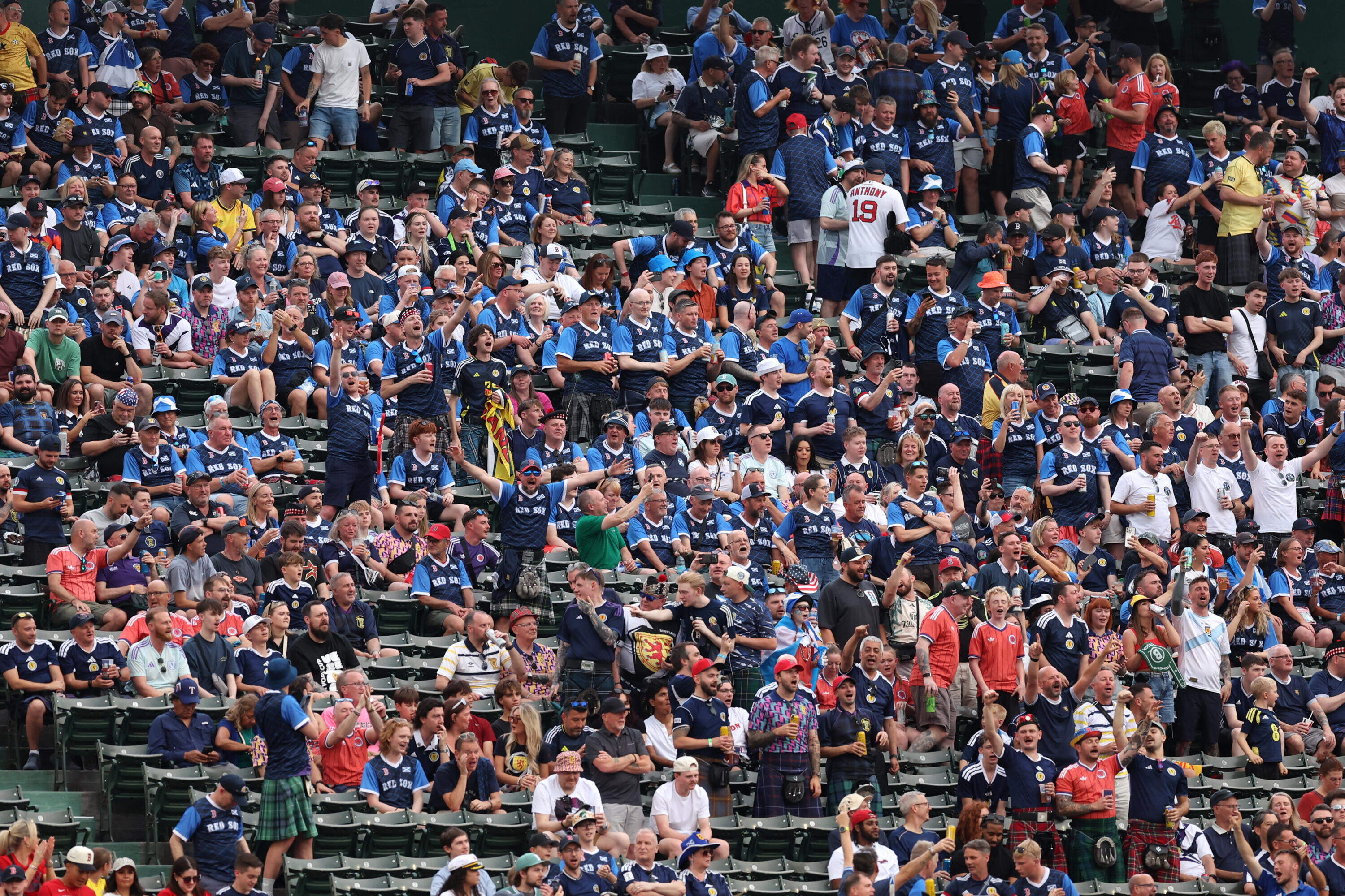 Members of Scotland's "Tartan Army" cheer during Sunday's game between the Texas Rangers and the Boston Red Sox at Fenway Park. (Photo by Paul Rutherford/Getty Images)