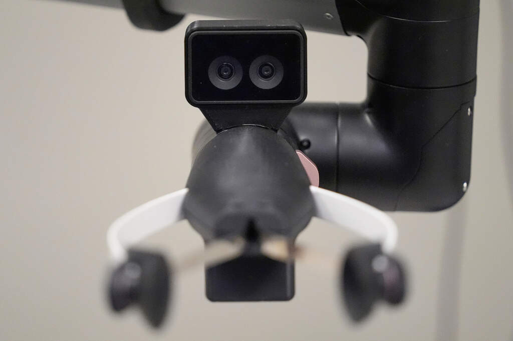 A camera on the hand of a Hello Robot uses two lenses for improved depth perception, during a demonstration at the University of New Hampshire. (Robert F. Bukaty/AP)