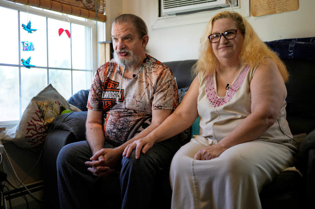 Brian and Brenda Marquis talk about a robot that helps them stay on task with everything from daily exercise to medication reminders at their apartment in Durham, N.H. (Robert F. Bukaty/AP)