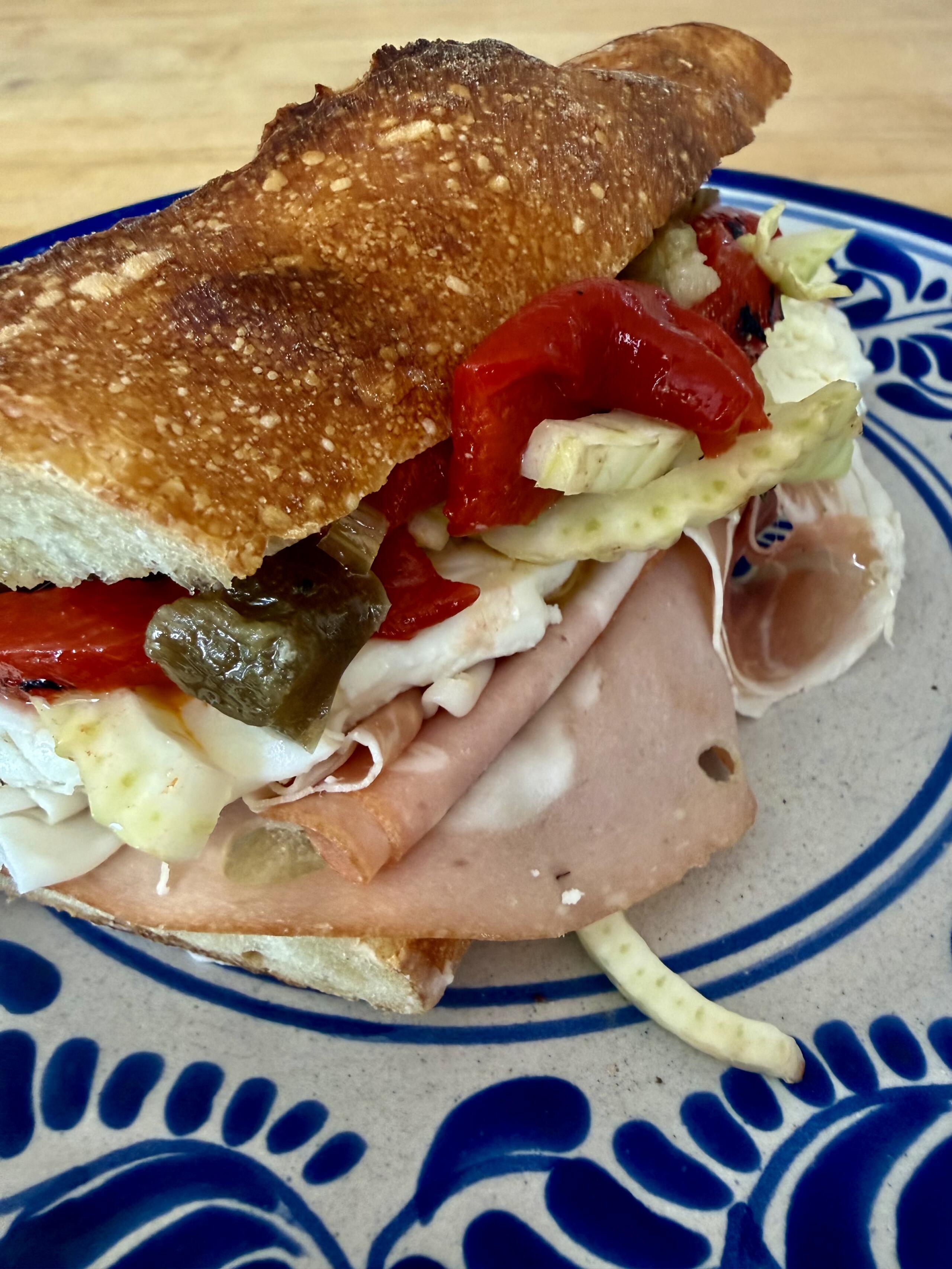 Italian meat and mozzarella sandwich with roasted red peppers, fennel shavings and giardiniera. (Kathy Gunst/Here & Now)