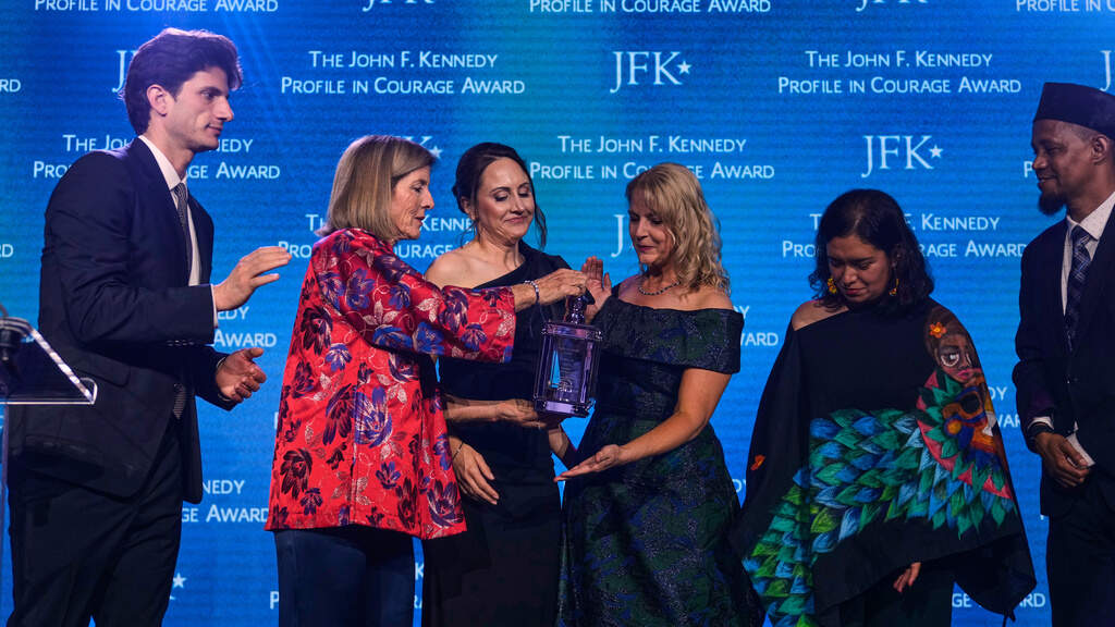 Former ambassador Caroline Kennedy, second from left, and her son Jack Schlossberg, left, present Natalie Ehret, Zena Stenvik, Carolina Ortiz and Imam Yusuf Abdulle (from left) the Profile in Courage Award during a ceremony at the John F. Kennedy Presidential Library, Sunday, May 31, 2026. (Charles Krupa/AP)