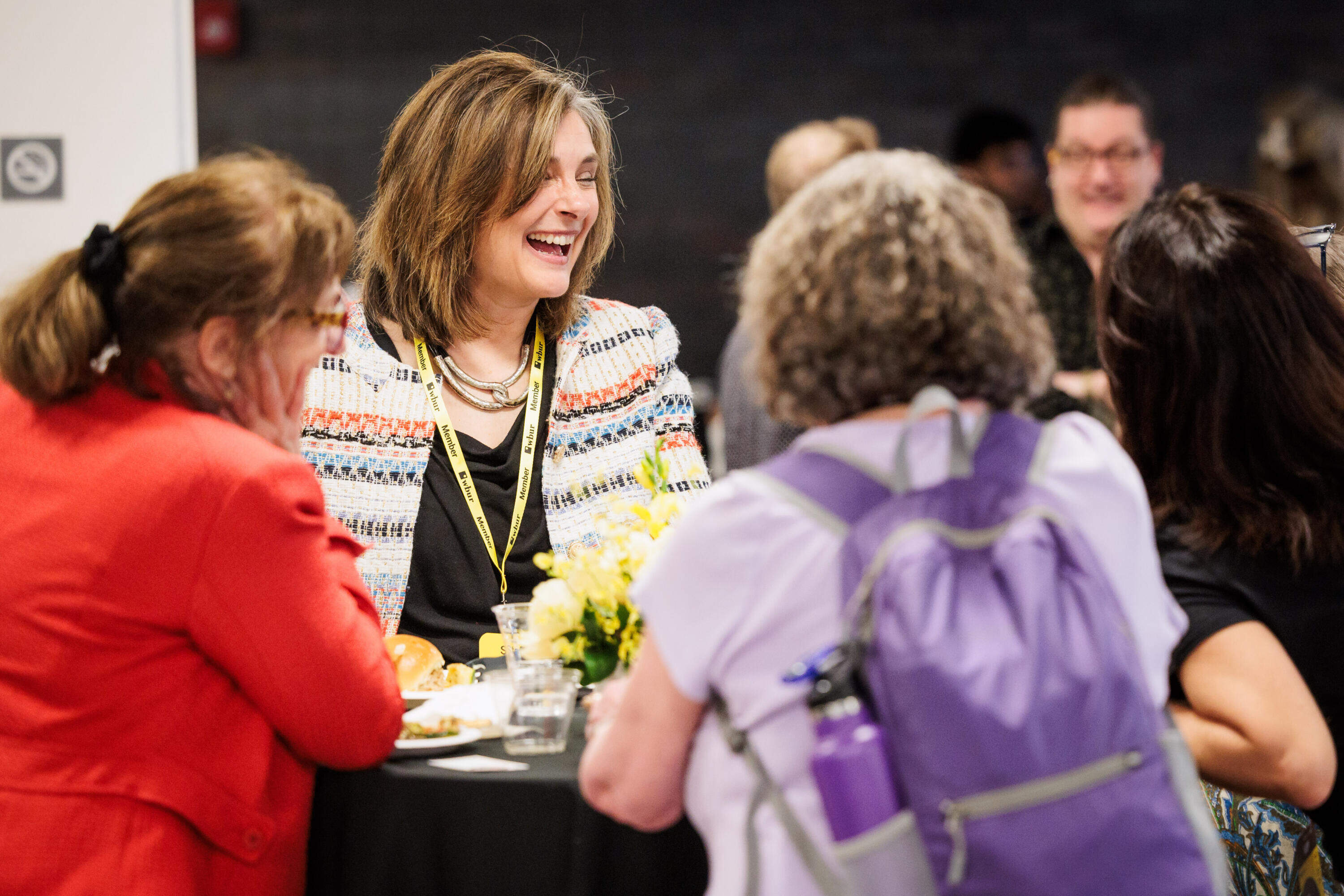 WBUR's Morning Edition host Tiziana Dearing laughs with festival attendees on May 29 in WBUR's CitySpace. (Nick Grace/Bolt Creative Group for WBUR)