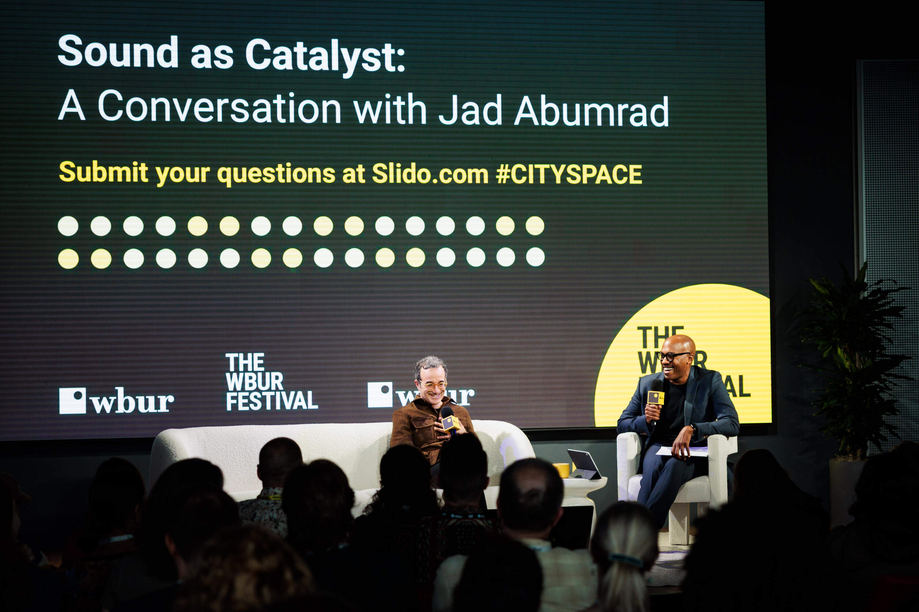 Creator of "Radiolab" Jad Abumrad speaks with NPR's Sam Sanders about the "art of sonic storytelling" at The WBUR Festival on May 29. (Nick Grace/Bolt Creative Group for WBUR)