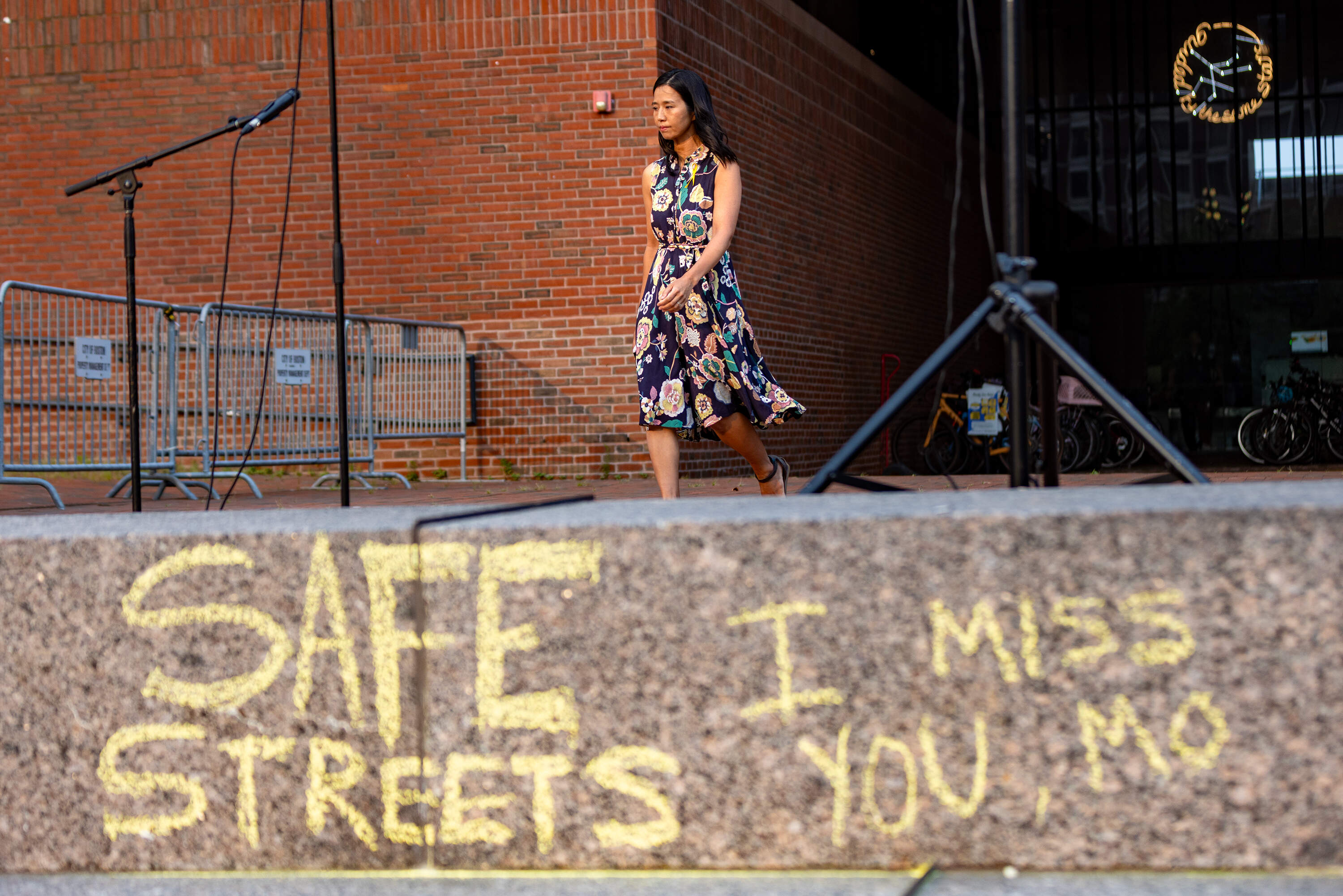 Michelle Wu makes her way to the podium to speak at the vigil for Louisa Gag at City Hall Plaza. (Jesse Costa/WBUR)