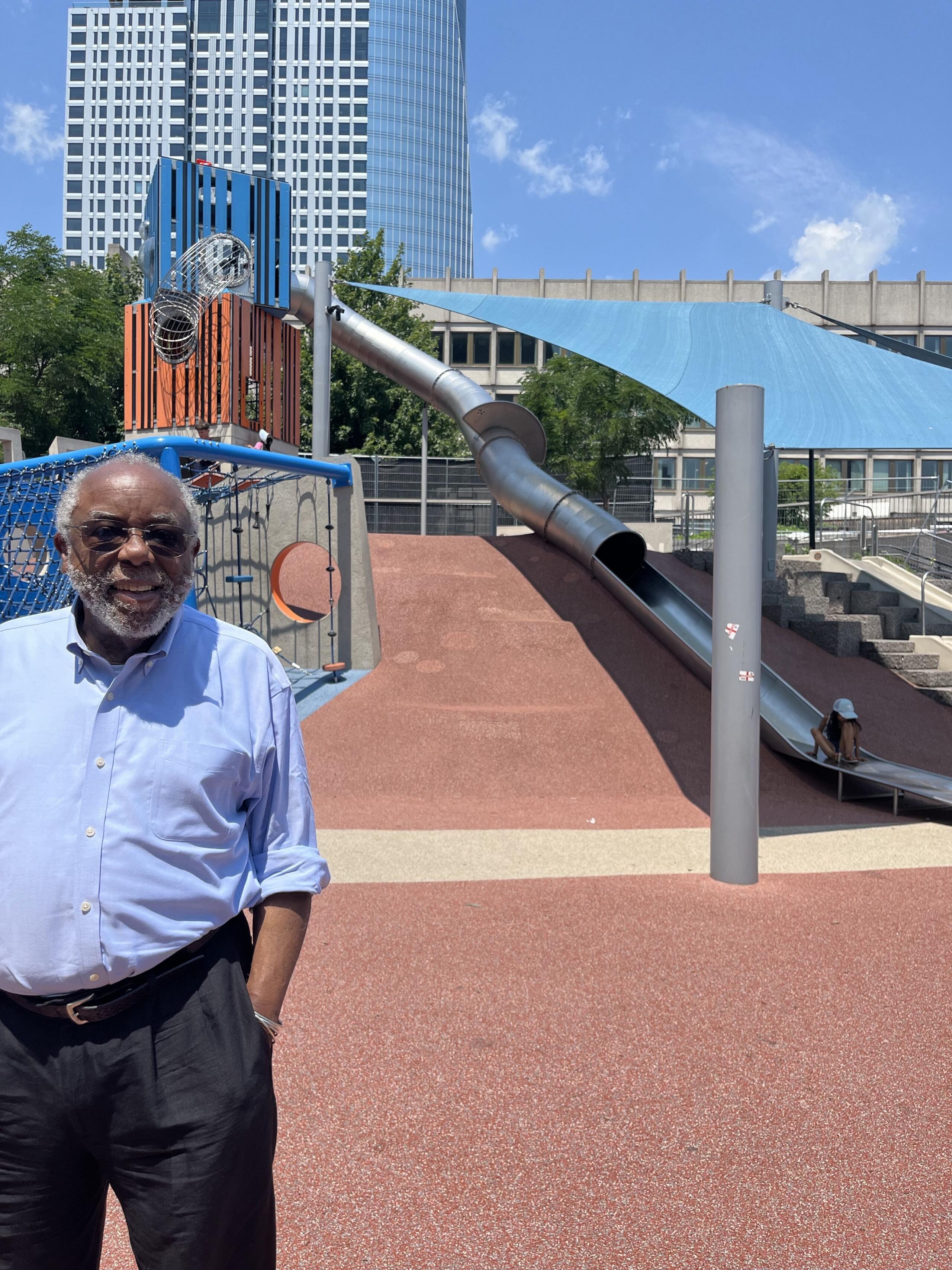 Ted Landsmark in front of the "cop slide" in Boston City Hall Plaza, 50 years after he was attacked. (Robin Young/Here & Now)