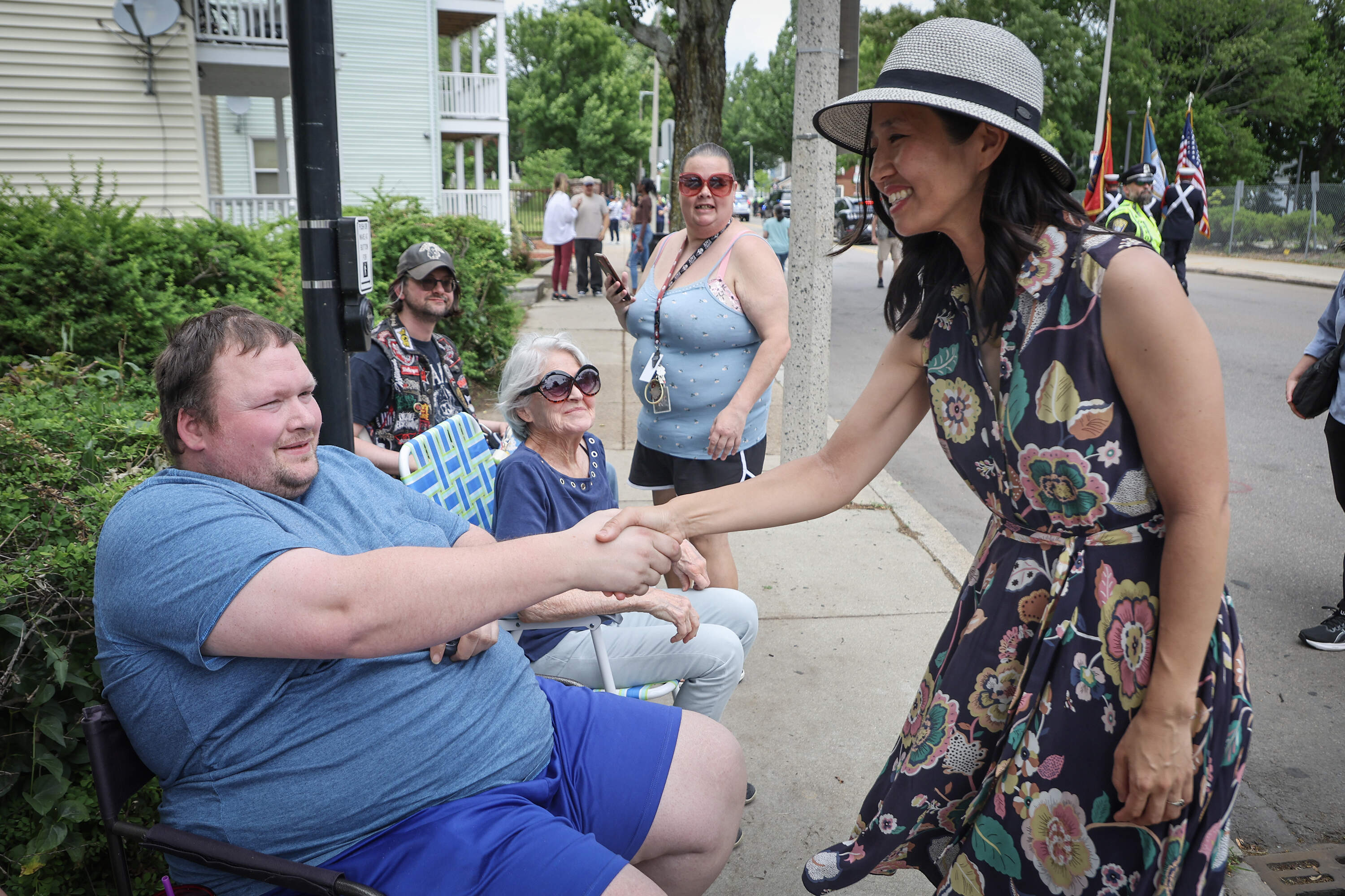 Boston Mayor Michelle Wu shakes hands with constituents during the Dorchester Day Parade on June 7. (Matthew J. Lee/The Boston Globe via Getty Images)