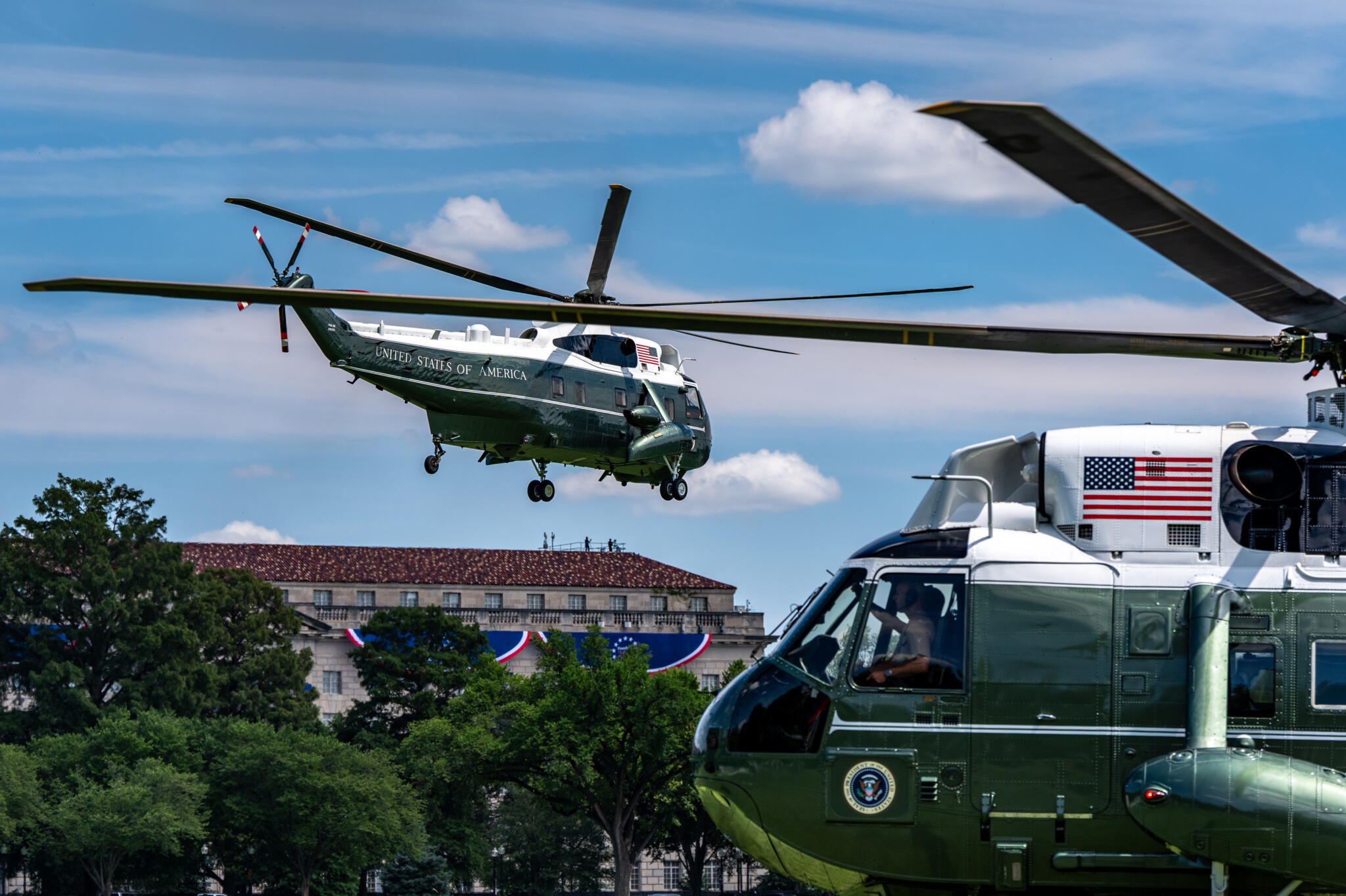 Marine One, left, with President Trump aboard, lifts off from the Ellipse, Tuesday, Aug. 4, 2026, in Washington. (Alex