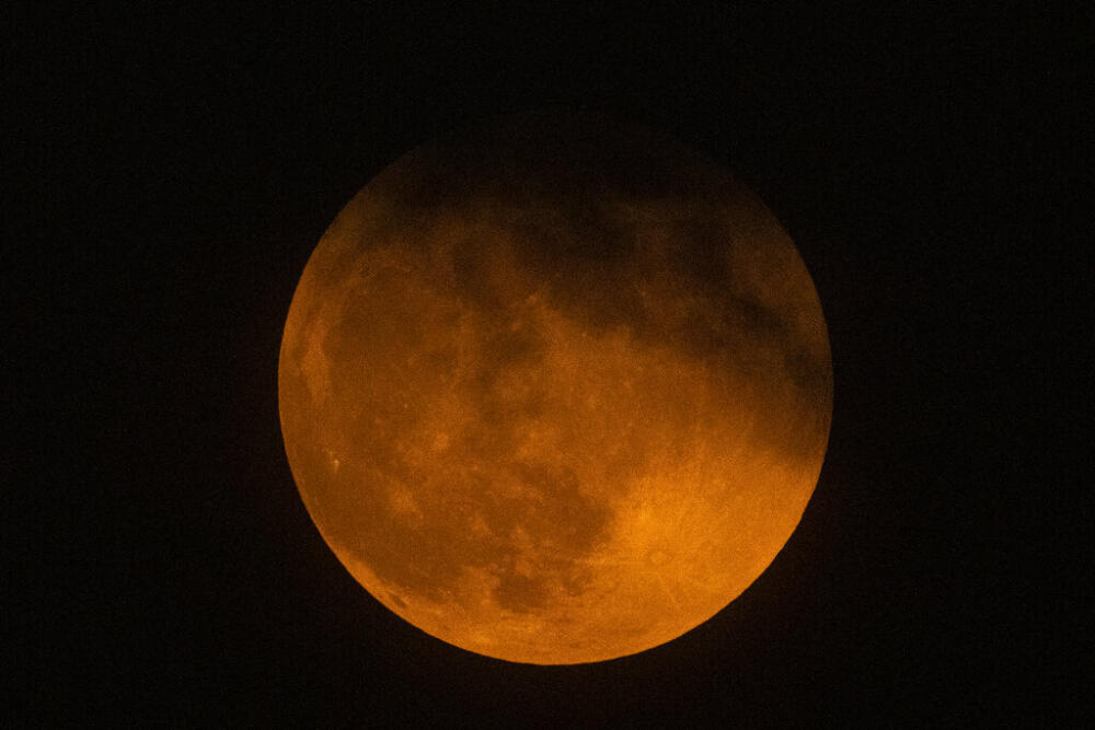 A near total lunar eclipse will pass over Boston Thursday. But, clouds might ruin the show