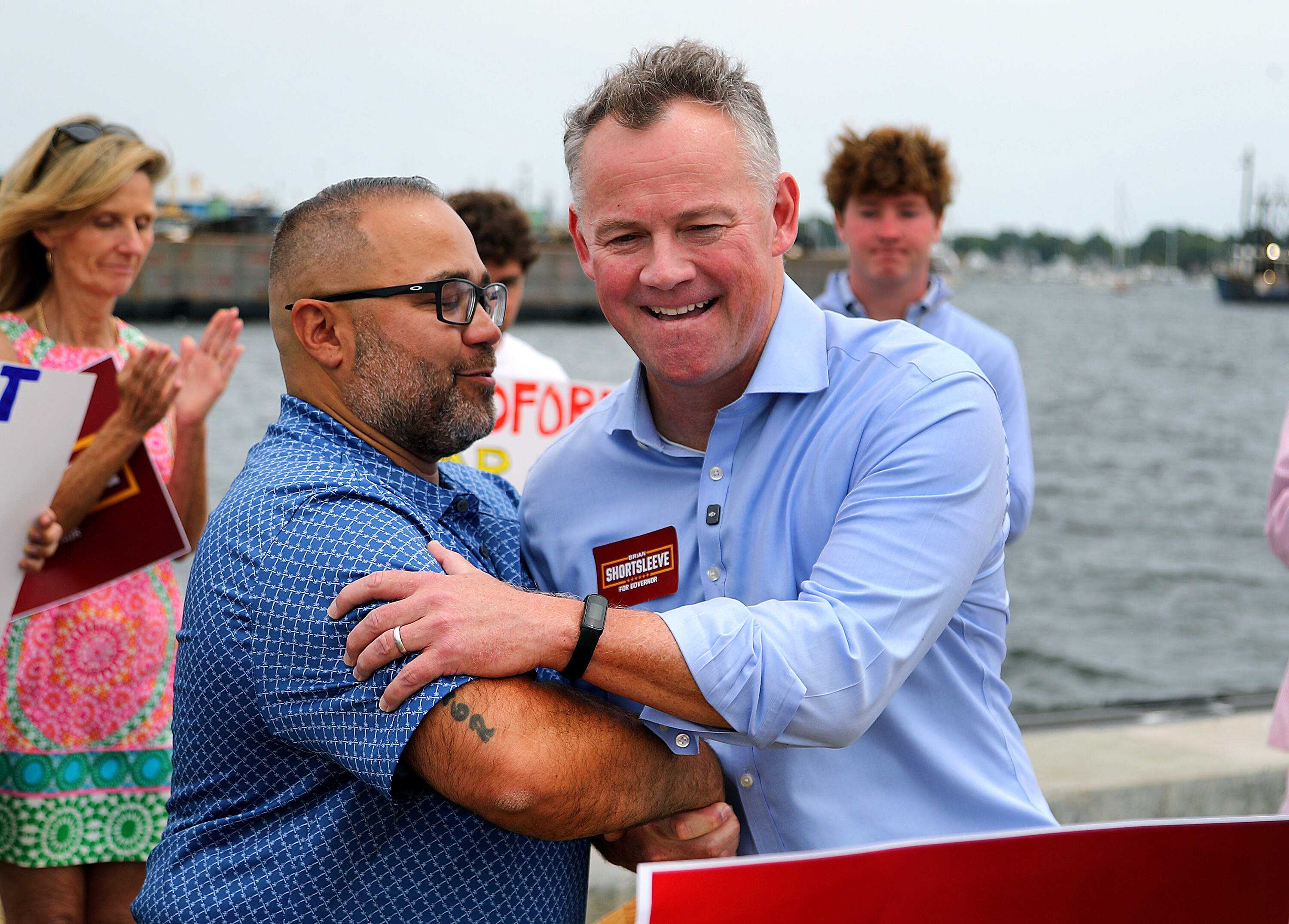 GOP gubernatorial candidate Brian Shortsleeve, right, shakes hands with his running mate, New Bedford City Councilor Shawn Oliver on July 21. (John Tlumacki/The Boston Globe via Getty Images)