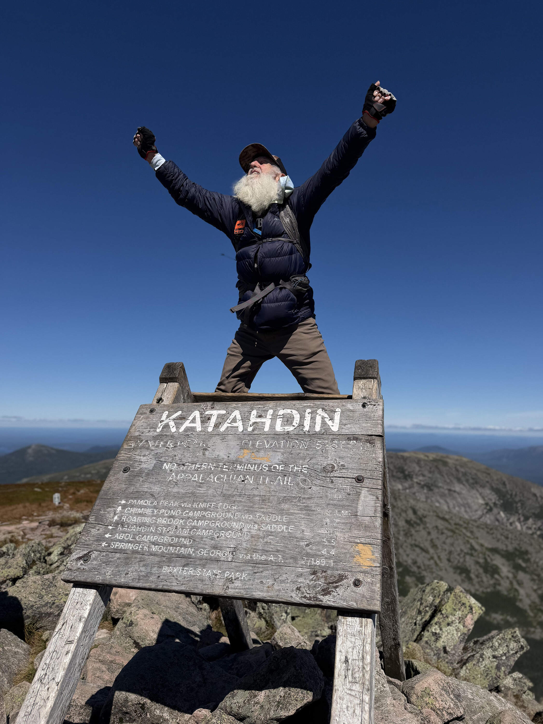 Dale Sanders, 91, celebrates upon completing his hike of the Appalachian Trail at the summit of Mt. Katahdin, Monday, Aug. 31, 2026 in Baxter State Park. (Robert F. Bukaty/AP)