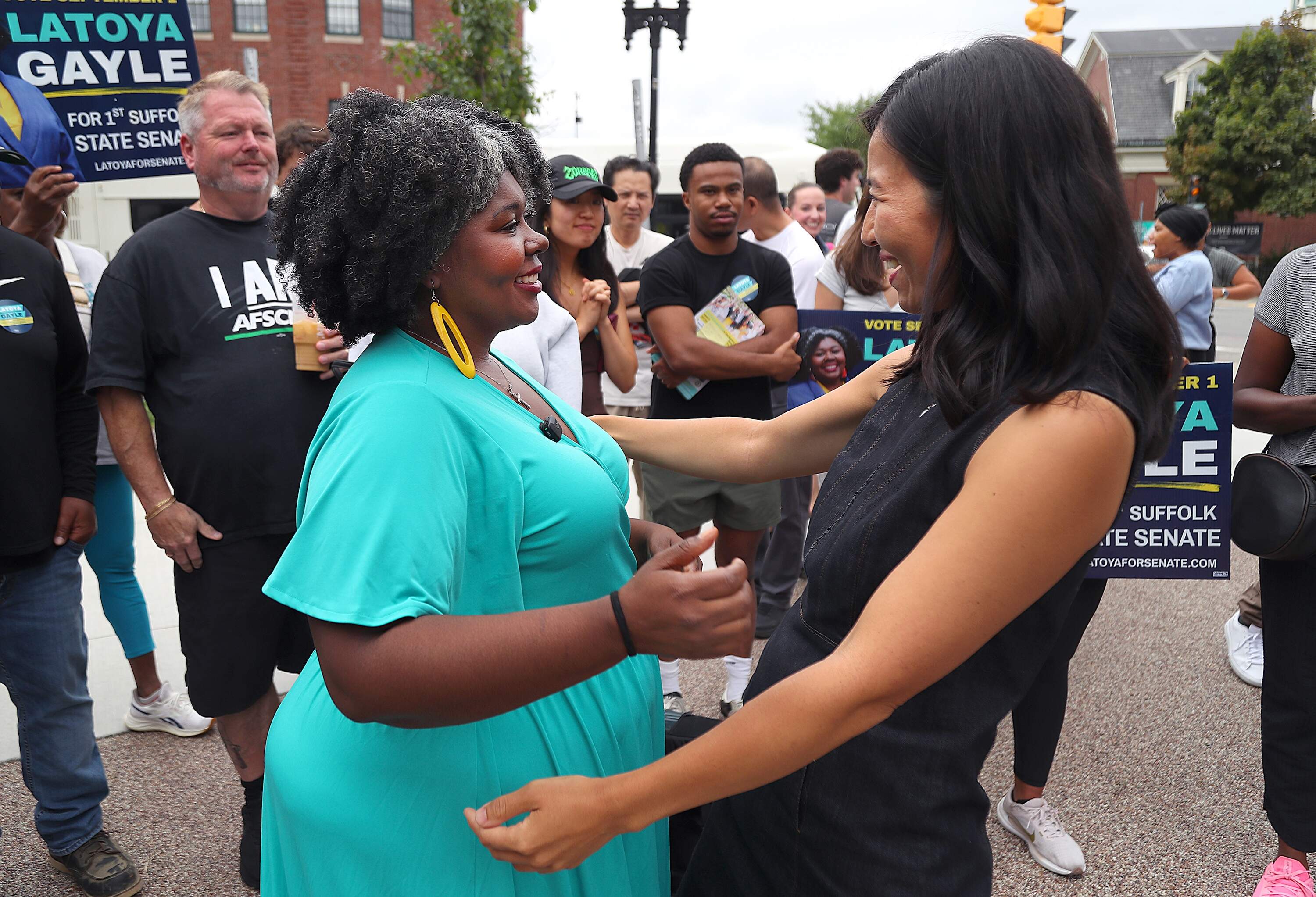 State Senate candidate Latoya Gayle greets Boston Mayor Michelle Wu at a rally on Talbot Avenue. (John Tlumacki/The Boston Globe via Getty Images)